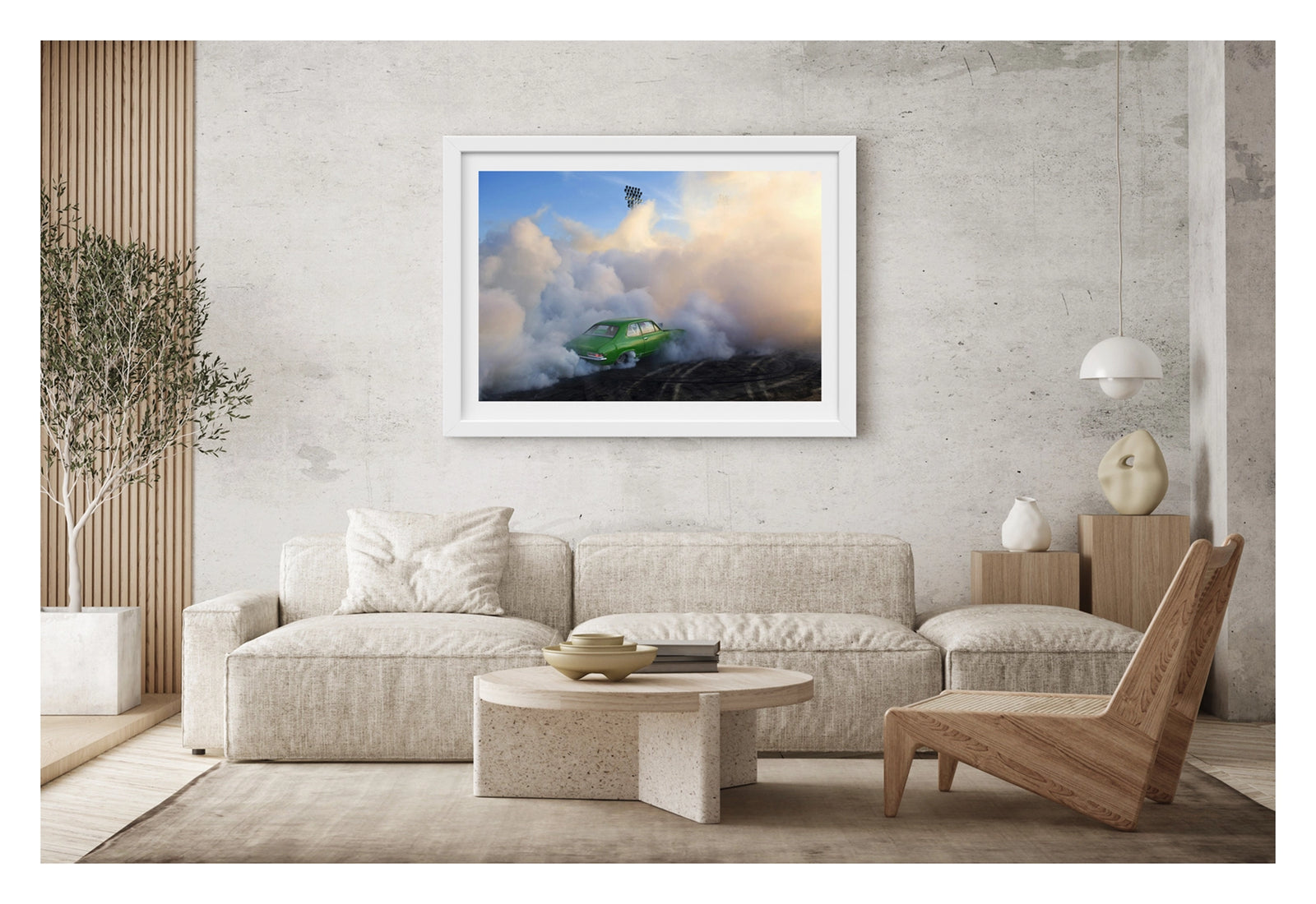 Framed in white, hanging in living space. We see a green Holden LJ Torana sedan performing a burnout, slightly engulfed against a towering wall of white and golden tyre smoke that billows up toward a deep blue sky. Stadium flood lights pierce the haze above as the smoke catches the warm evening light, the bright green body of the car vivid against the swirling white cloud and the rubber marked black bitumen below. Fine art colour photographic print by Simon Davidson.