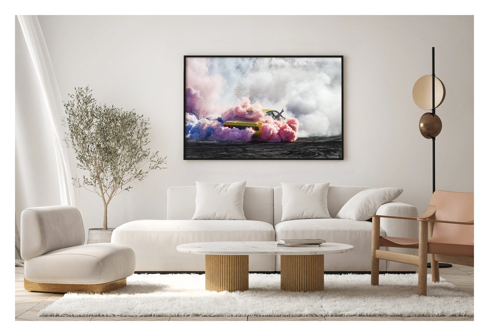 Framed in black, shown in a contemporary living space. A yellow Holden Commodore performs a burnout before a grandstand crowd, engulfed in a spectacular multicoloured cloud of pink, blue and white tyre smoke that swirls across the tyre marked black bitumen. A driver's arm reaches through the window with a single finger pointed skyward as the vibrant smoke rolls in every direction, the red tail lights glowing through the haze. Fine art colour photographic print by Simon Davidson.