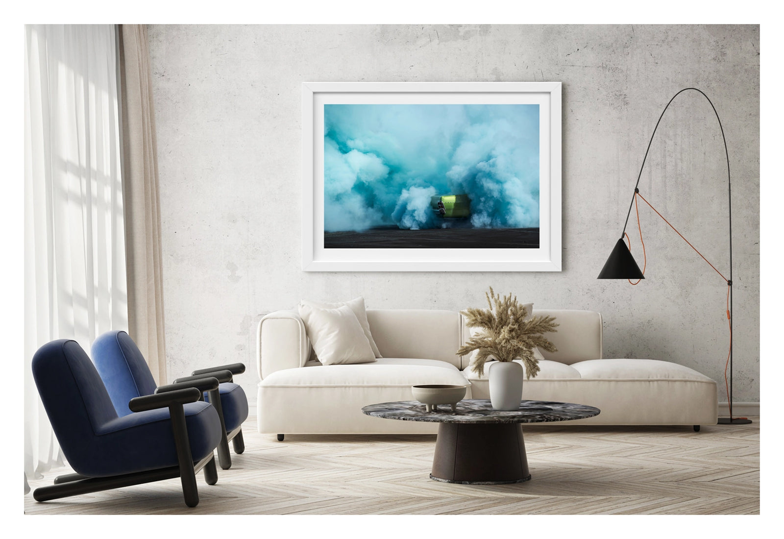 Framed in white. The rear of metallic green Valiant Regal is almost completely consumed by a vast billowing cloud of vivid teal tyre smoke during a burnout. The electric contrast of the bright green body against the churning aqua smoke creates a striking abstract quality, the car appearing to float above the scorched black bitumen below. Framed print shown in a contemporary room. Fine art colour photographic print by Simon Davidson.
