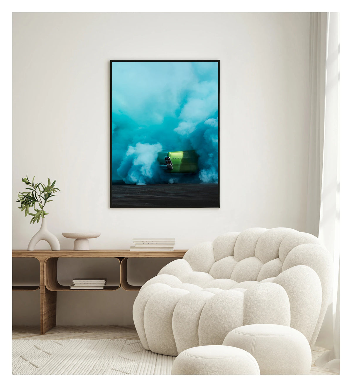 Framed in black in a portrait orientation. The rear of metallic green Valiant Regal is almost completely consumed by a vast billowing cloud of vivid teal tyre smoke during a burnout. The electric contrast of the bright green body against the churning aqua smoke creates a striking abstract quality, the car appearing to float above the scorched black bitumen below. Framed print shown in a contemporary room. Fine art colour photographic print by Simon Davidson.
