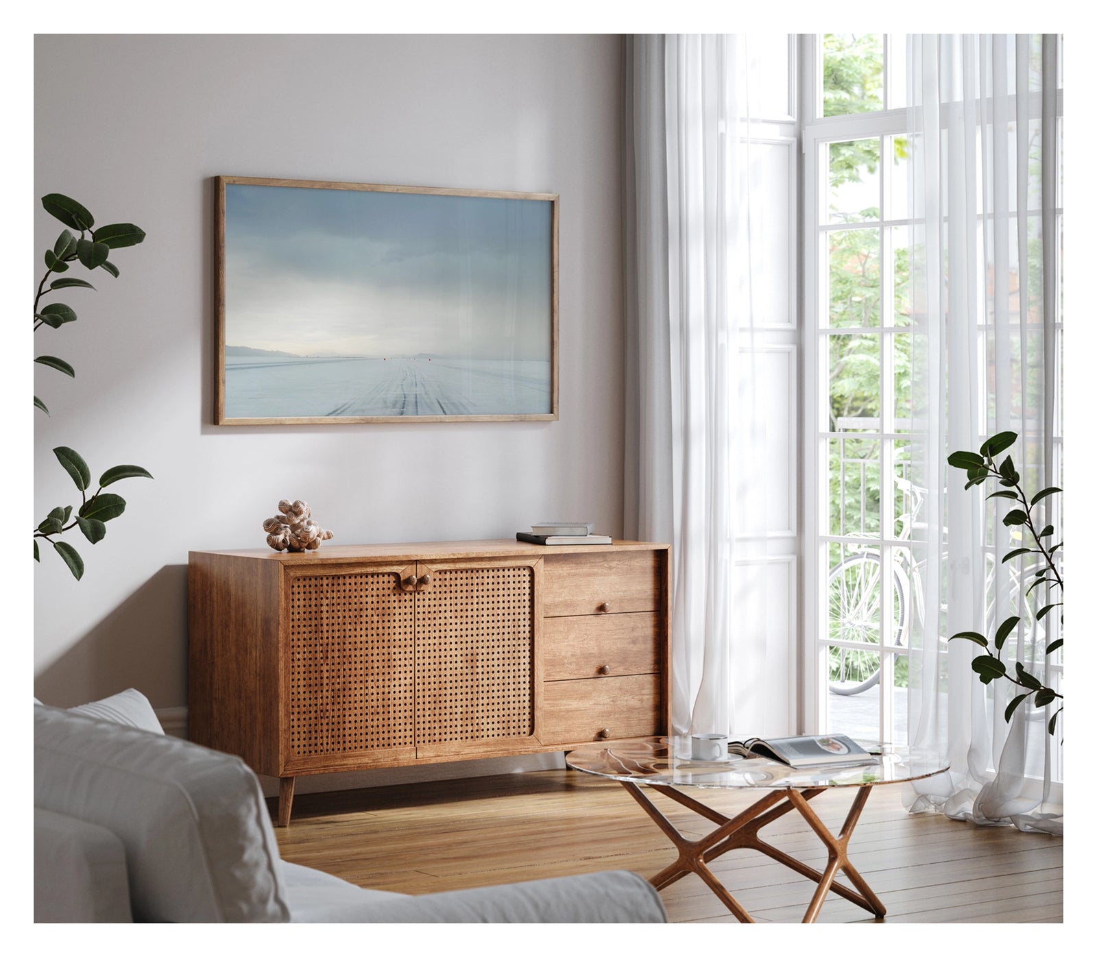 Framed in timber, hanging in a contemporary living space. We see the No.1 race track of the Bonneville Salt Flats stretches to the vanishing point under a heavy brooding storm sky, tyre tracks scoring the salt surface as a row of small red timing markers disappear into the horizon toward a distant mountain range. The threatening grey sky and luminous horizon create a dramatic sense of foreboding over the otherwise empty and silent expanse. Fine art colour photographic print by Simon Davidson.