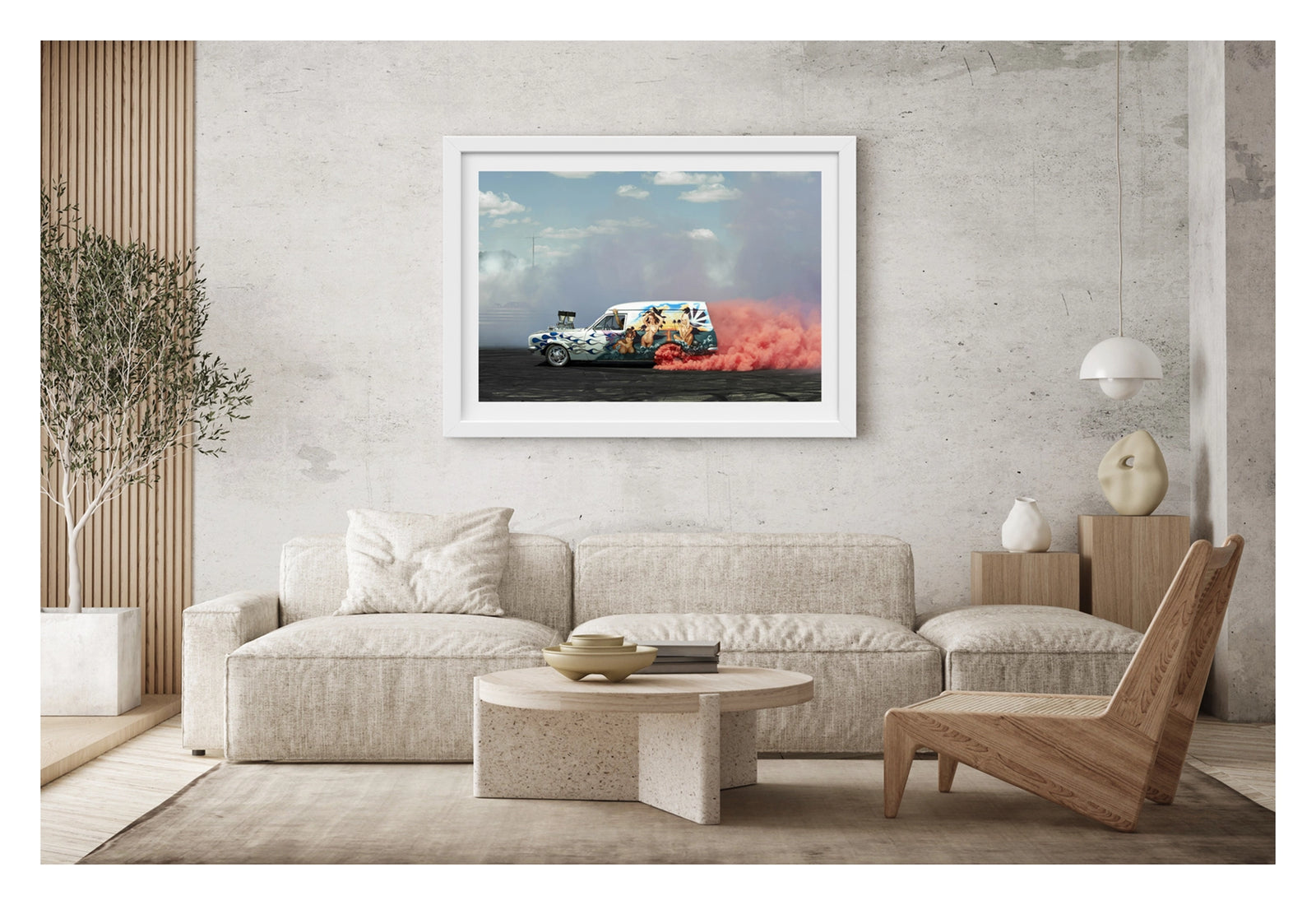 Framed in white. A heavily customised Australian panel van with an elaborate tropical mural and blue flame paintwork lays down a burnout under a blue sky with scattered clouds, pink tyre smoke erupting from the rear wheels and trailing behind as white smoke drifts across the left side of the frame. Supercharger protrudes through the bonnet. The lavishly painted side panel depicting a sunset beach scene in 1970s van culture glory. Fine art photographic print by Simon Davidson.