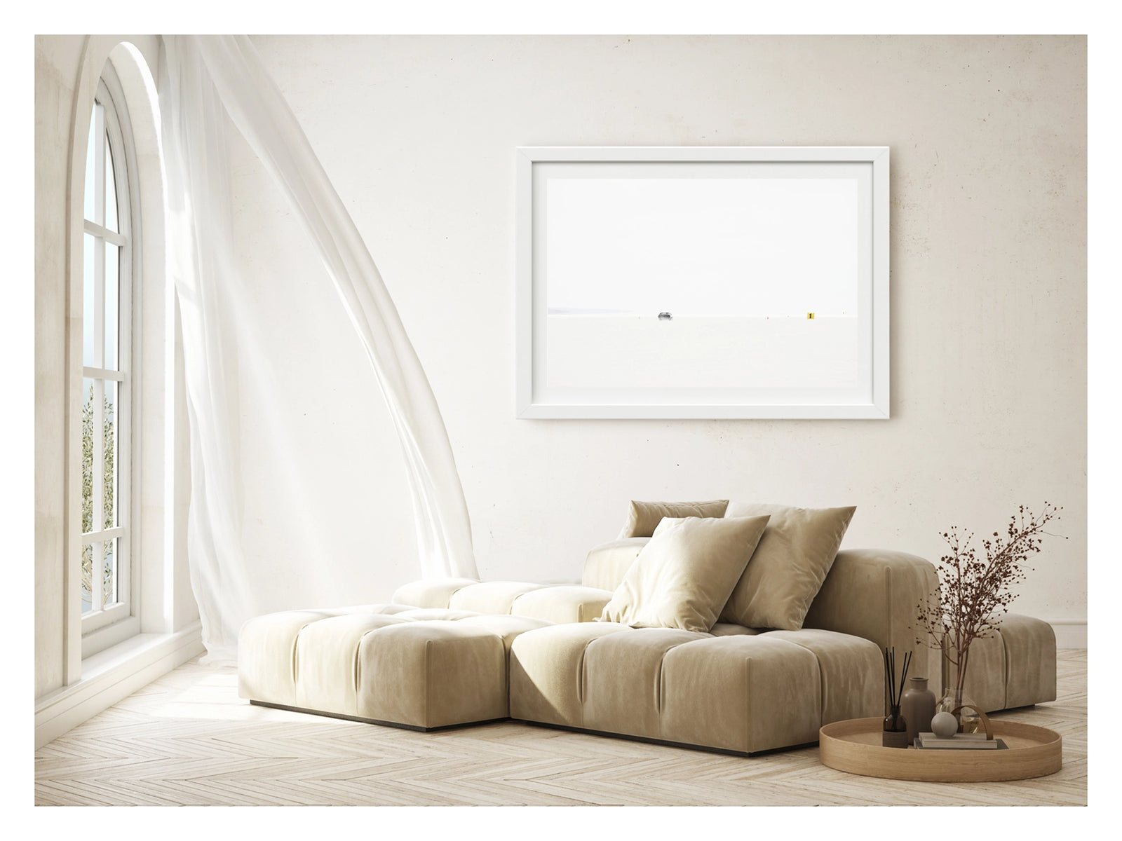 Framed in white, shown in a contemporary living space. An Australian Ford XB Falcon landspeed race car appears tiny as it races down Lake Gairdner, almost entirely swallowed by the blinding white salt and pale sky. It makes a high speed run past small orange cones and a yellow number one marker. The extreme minimalism of the composition reduces the car and the entire drama of speed to a single small detail in an overwhelming expanse of white. Fine art colour photographic print by Simon Davidson.