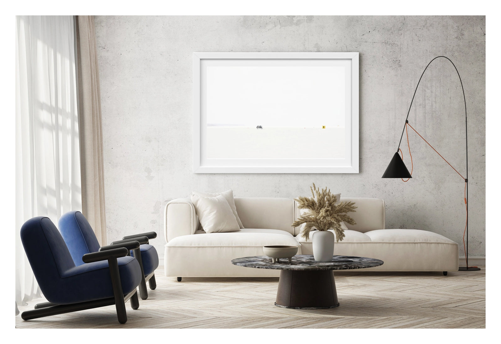 Framed in white, shown in a contemporary living space. An Australian Ford XB Falcon landspeed race car appears tiny as it races down Lake Gairdner, almost entirely swallowed by the blinding white salt and pale sky. It makes a high speed run past small orange cones and a yellow number one marker. The extreme minimalism of the composition reduces the car and the entire drama of speed to a single small detail in an overwhelming expanse of white. Fine art colour photographic print by Simon Davidson.