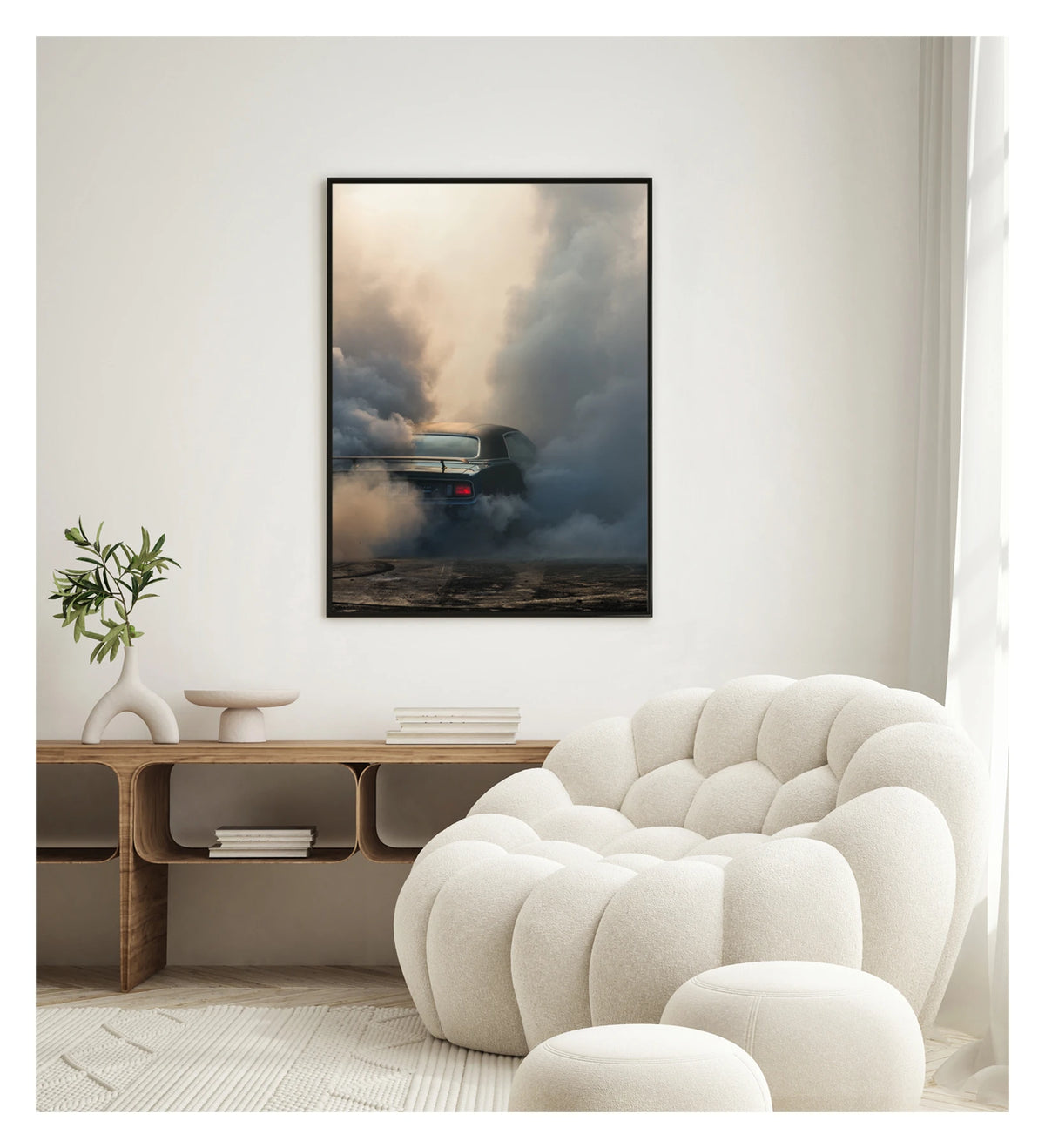 Captured in a portrait orientation. Framed in black. We see the rear of a black Plymouth Barracuda with a vinyl roof performing a burnout, almost entirely consumed by billowing clouds of tyre smoke that fill the frame from ground to sky. A single red tail light glows through the haze as rubber marks streak the bitumen below. Fine art colour photographic print by Simon Davidson.