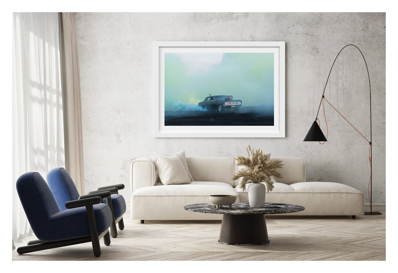 Framed in white, shown in a contemporary living space. A black Holden HD sedan with a supercharger out the bonnet, bearing the number plate UCSMOKE, performs a burnout surrounded by vast aquamarine tyre smoke that bathes the entire scene in soft blue green light. A driver's arm reaches out the window above the roofline, as aqua smoke rolls low across the ground and the ethereal coloured haze fills the sky behind. Fine art colour photographic print by Simon Davidson.